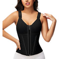 Woman wearing a black waist training corset on a white background