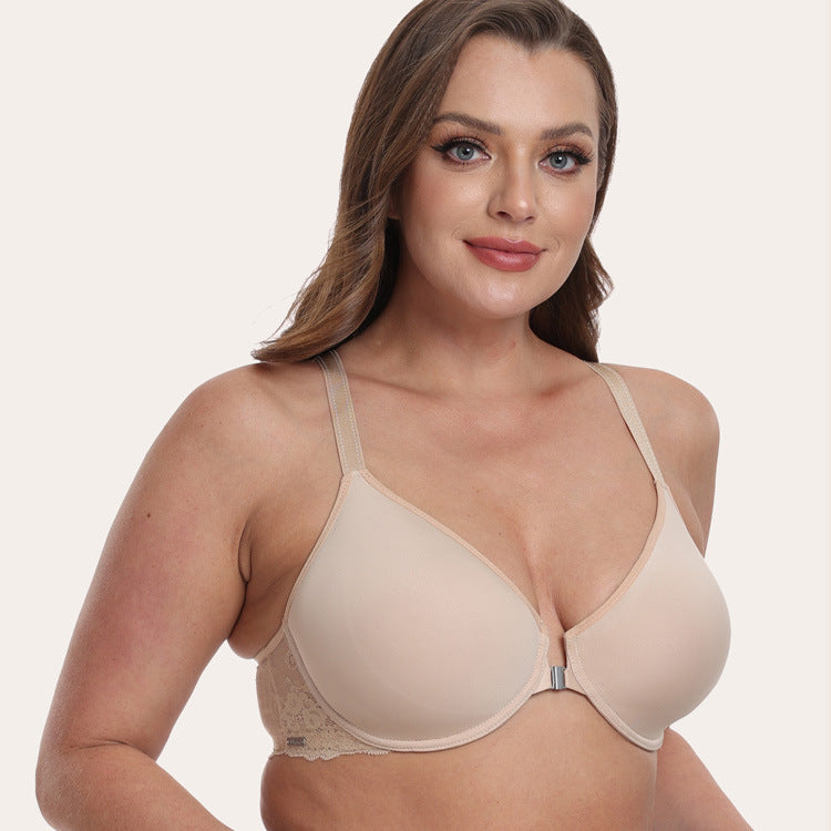 Woman wearing a beige bra on a plain background