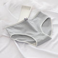 Gray women's underwear on a white fabric background