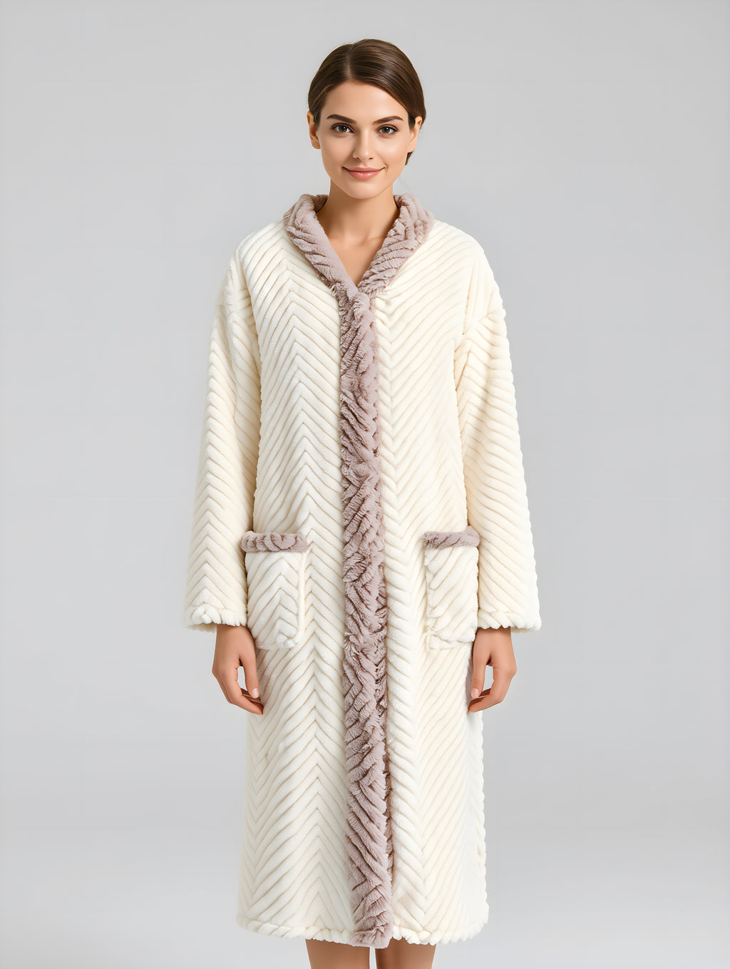 Woman wearing a long, cream-colored robe with fur trim on a gray background