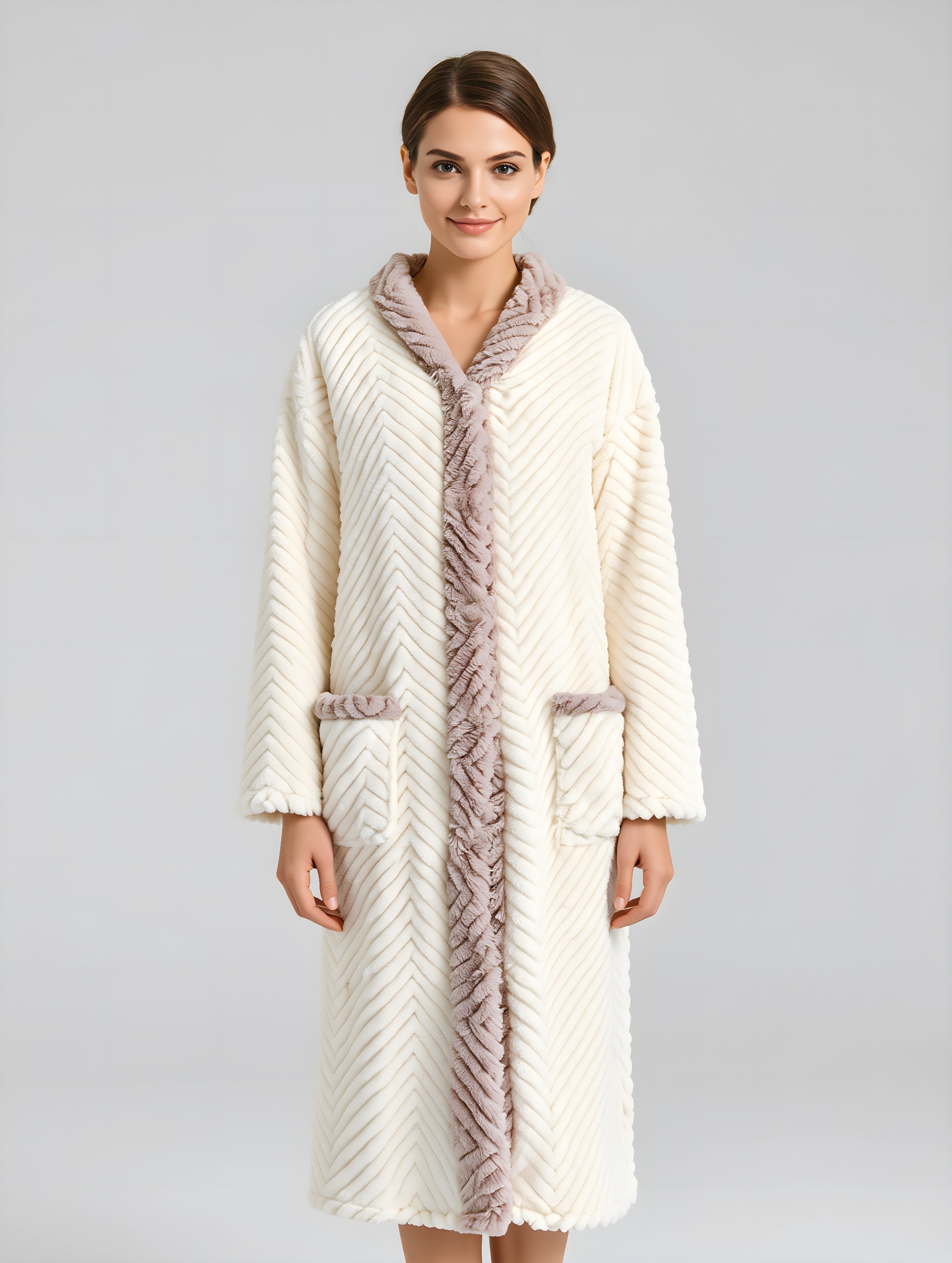 Woman wearing a long, cream-colored robe with fur trim on a gray background