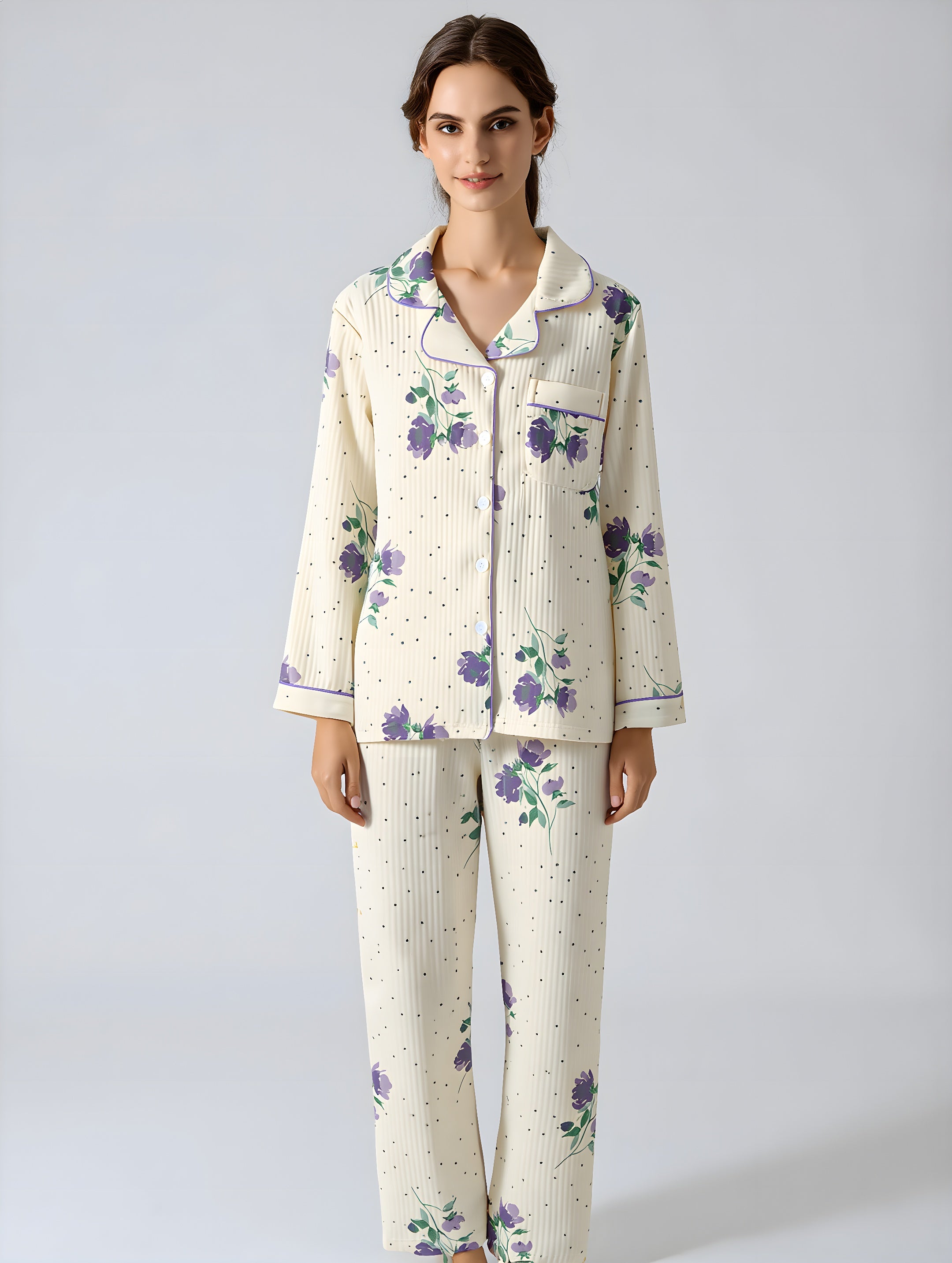 Woman wearing a floral pajama set on a plain background