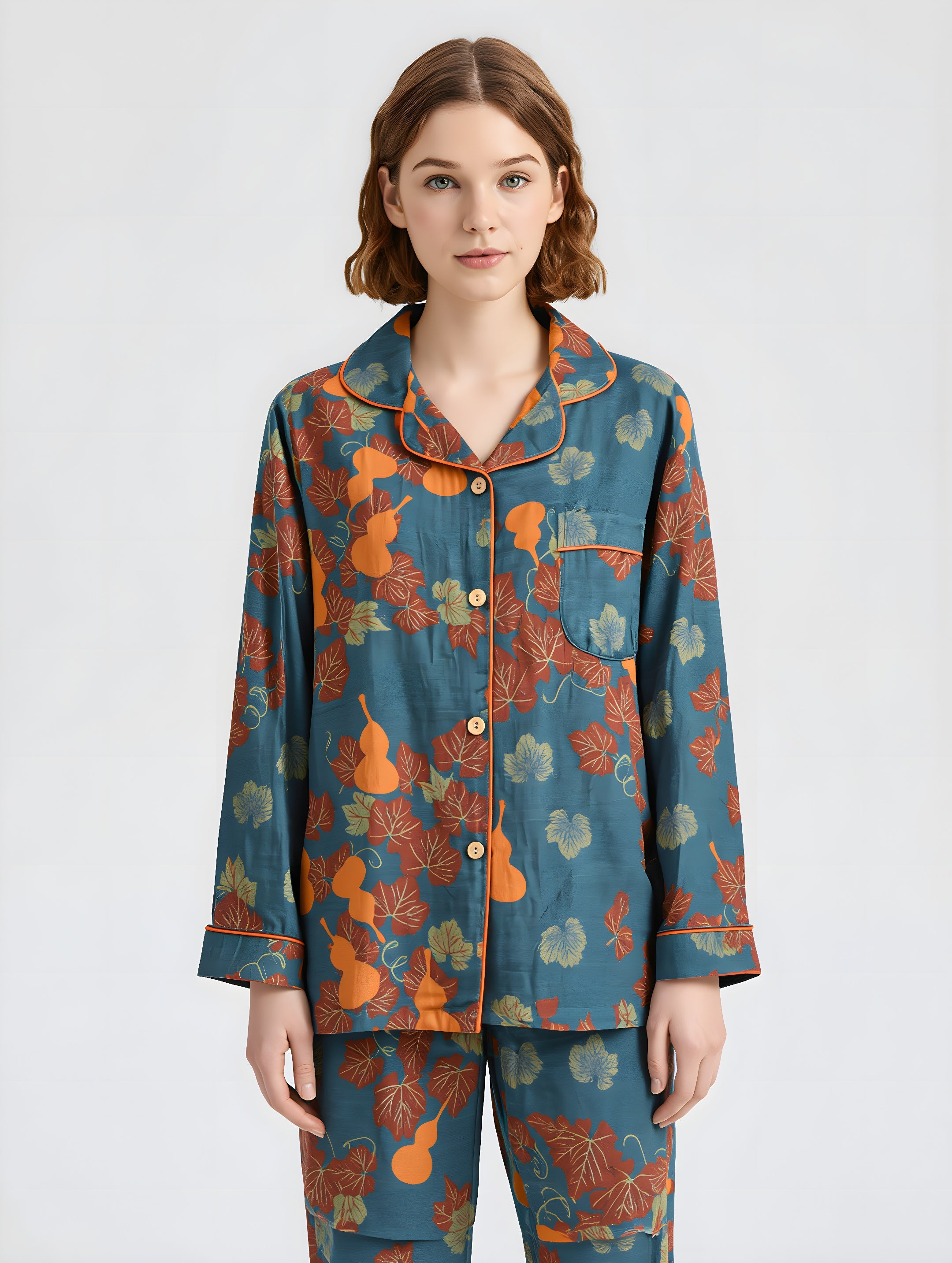 Woman wearing a blue floral pajama set on a white background