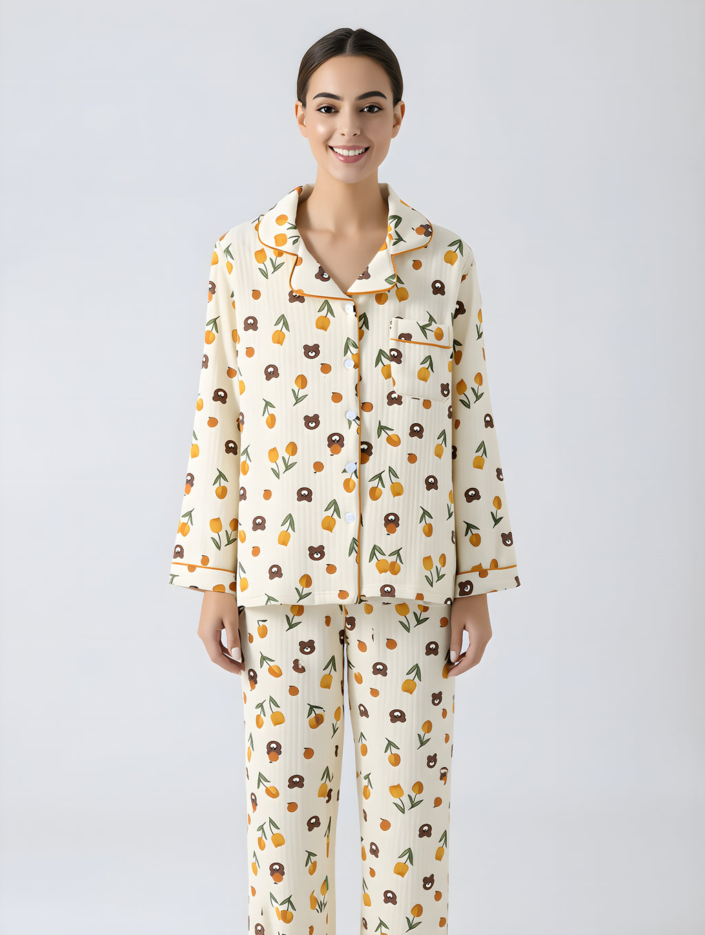 Woman wearing a patterned pajama set on a plain background