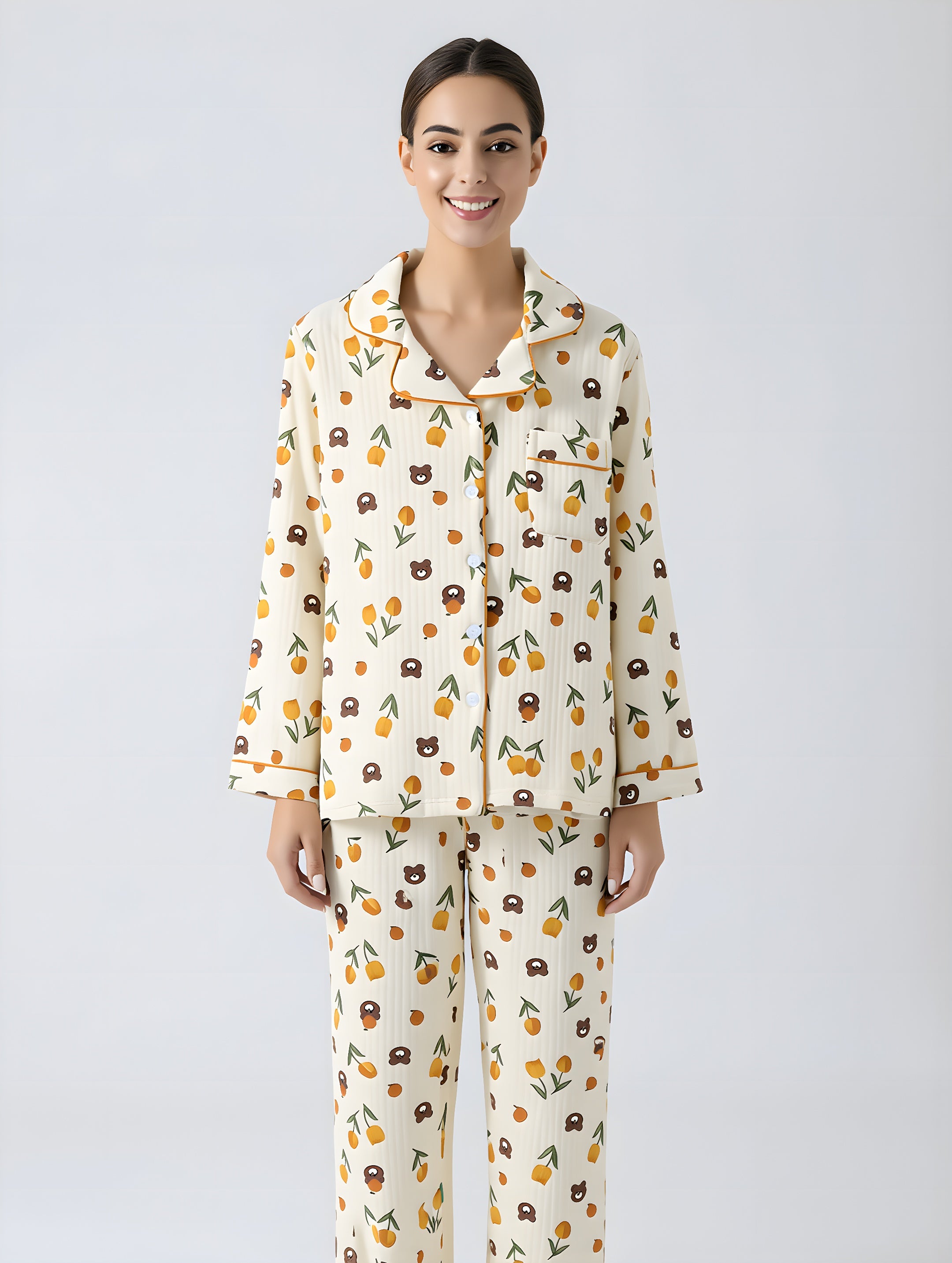 Woman wearing a patterned pajama set on a plain background